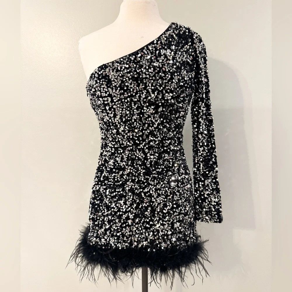 Better Be size M sequin midi dress with feather bottom. Black silver